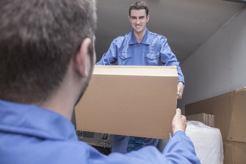 Team loading furniture into a van near Brent flats
