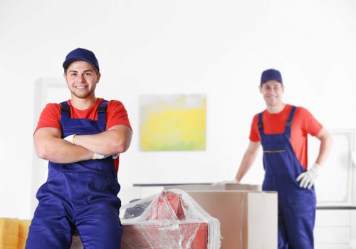 Moving team handling a residential move in Brent with boxes and furniture