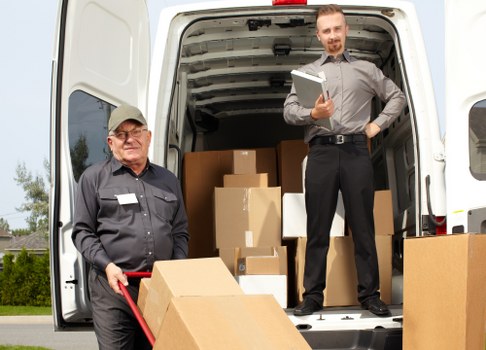 House movers helping a Brent family move furniture from a home