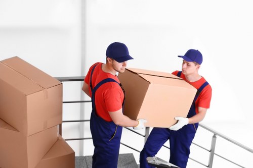 Removal van and movers serving a residential street in Brent