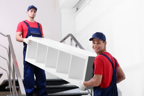 Removal team planning a move in a Brent residential street