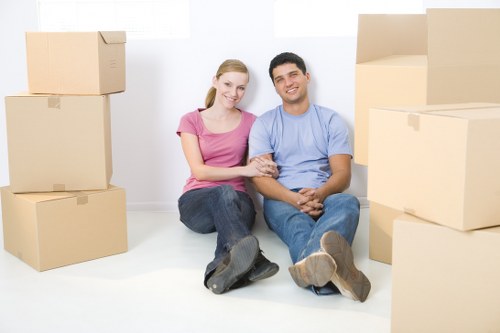 Professional movers handling a flat removal in Brent with care