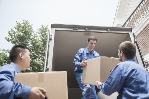 Man with a van loading furniture for a local move in Brent