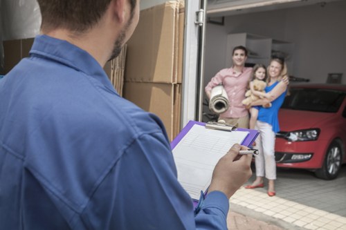Removal van on a residential street in Brent with moving equipment