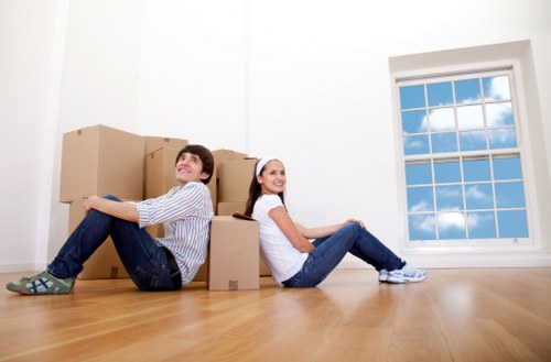 Furniture removal team handling a sofa collection in Brent