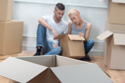 Moving van and packed boxes for a home move in Brent