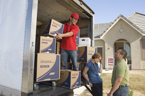 Loading furniture into a removal truck in Brent