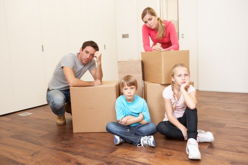 Preparing boxes and furniture for a move with a Brent moving truck