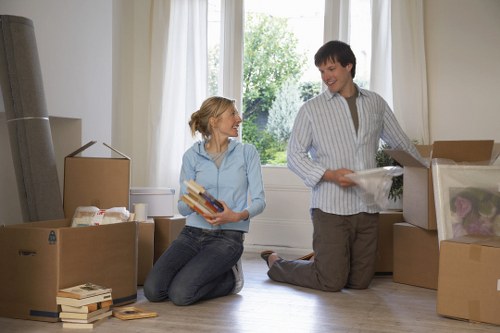 Loading furniture into a moving van in Brent