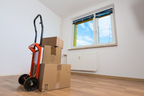Packed boxes and furniture ready for collection in Brent
