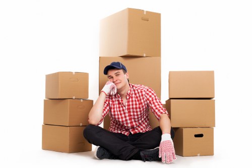 Packed boxes and furniture ready for removal truck hire in Brent